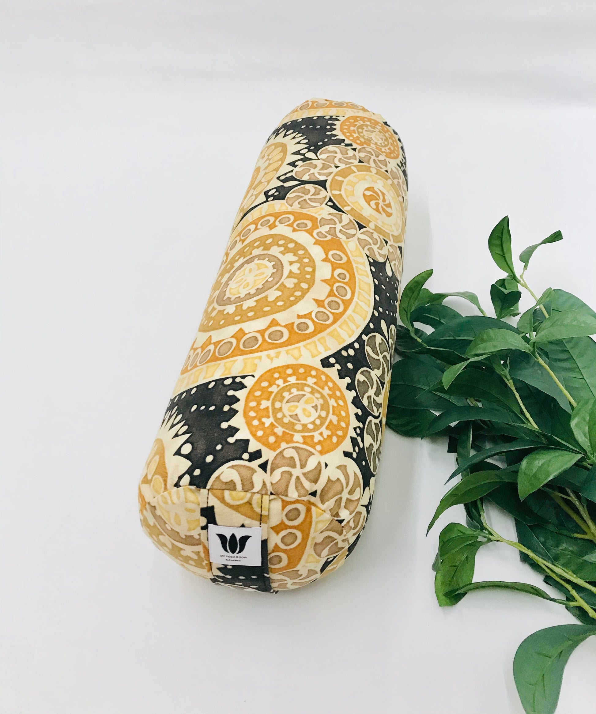 Round yoga bolster in durable cotton canvas, in black and bright colour novelty print fabric. Allergy conscious fill with removeable cover. Made in Canada by My Yoga Room Elements