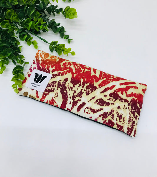 Yoga eye pillow, unscented, therapeutically weighted to soothe eye strain and stress or enhance your savasana. Handcrafted in Canada by My Yoga Room Elements. Orange/pink/purple modern print and bamboo fabric.