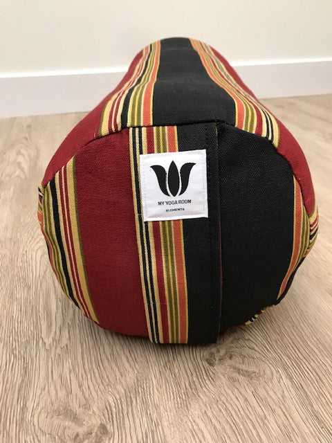 Round yoga bolster in cotton canvas, strip fabric in black, red, beige and gold fabric. Allergy conscious fill with removeable cover. Made in Canada by My Yoga Room Elements