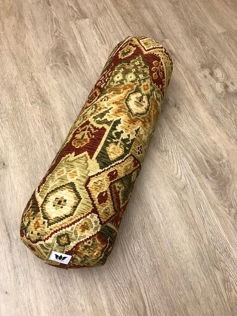 Round yoga bolster in cotton canvas in earth tone ikat print fabric. Allergy conscious fill with removeable cover. Made in Canada by My Yoga Room Elements