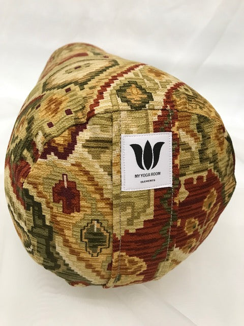 Round yoga bolster in cotton canvas in earth tone ikat print fabric. Allergy conscious fill with removeable cover. Made in Canada by My Yoga Room Elements