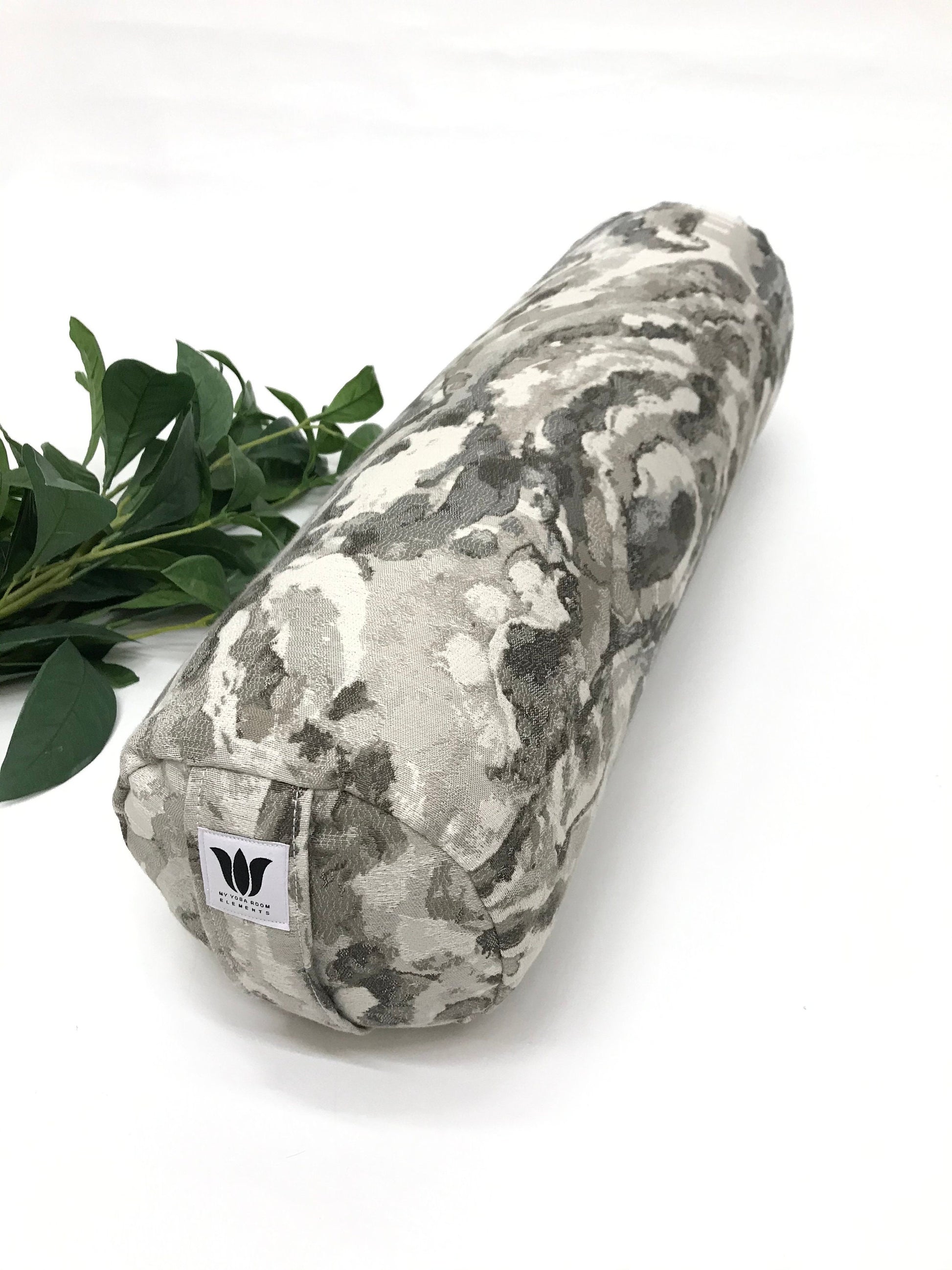 Round yoga bolster in durable cotton, grey and white marble print fabric. Allergy conscious fill with removeable cover. Made in Canada by My Yoga Room Elements